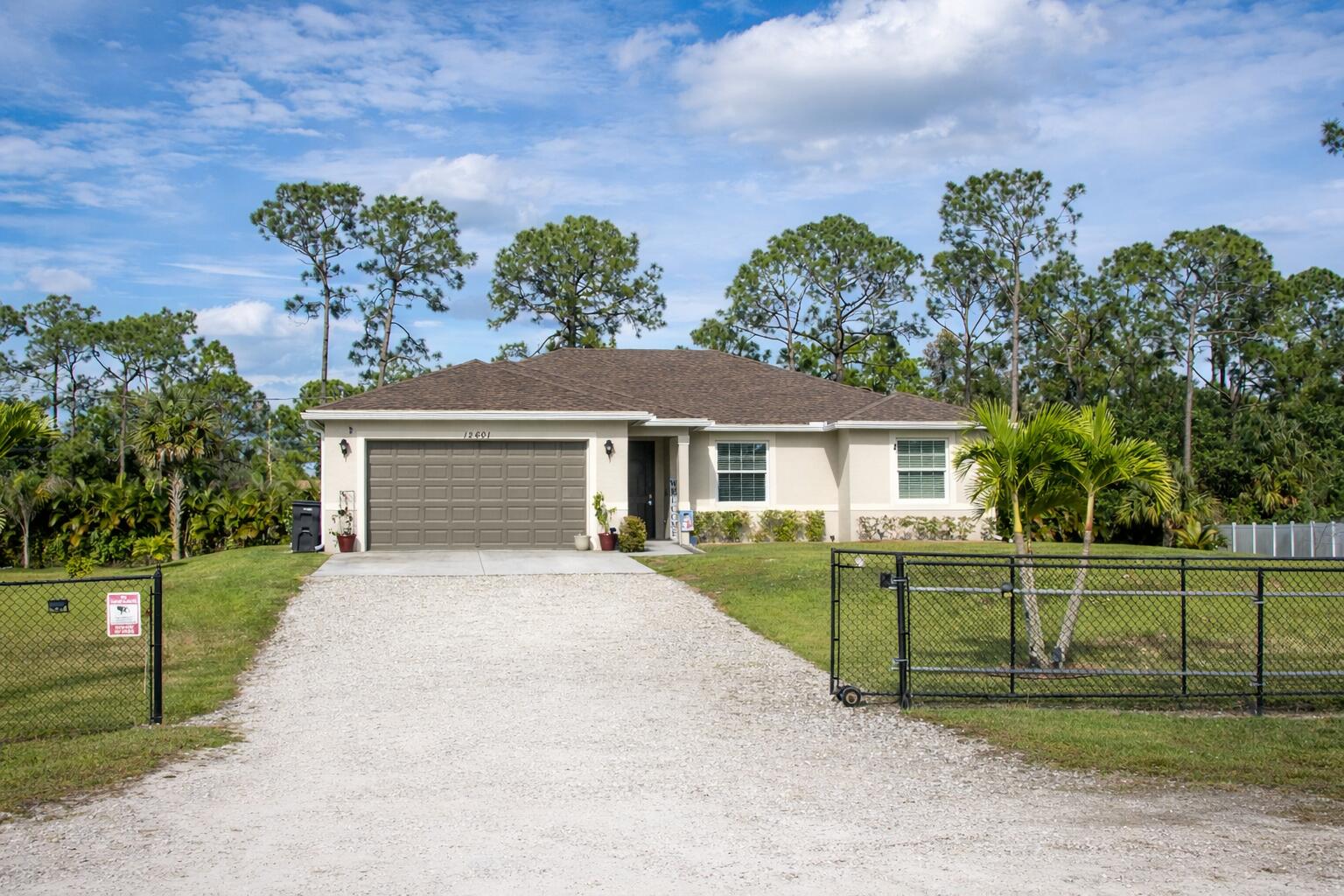 12601 57th Road North West Palm Beach, FL 33411 - Photo 2 of 24 Modern home in wooded suburbia