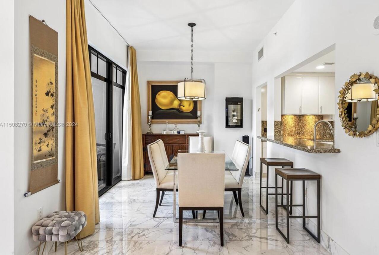 200 East Palmetto Park Road, Unit 16 Boca Raton, FL 33432 - Photo 4 of 4 a dining room with furniture and window