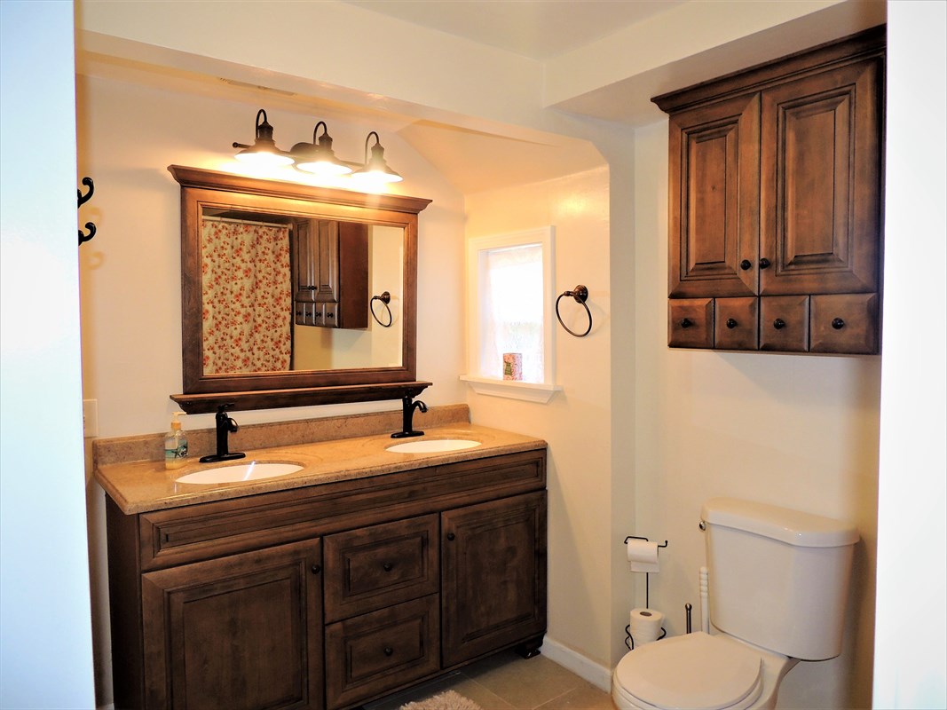 81-1073 Captain Cook Road, Unit A Captain Cook, HI 96704 - Photo 7 of 25 a bathroom with a toilet sink and mirror