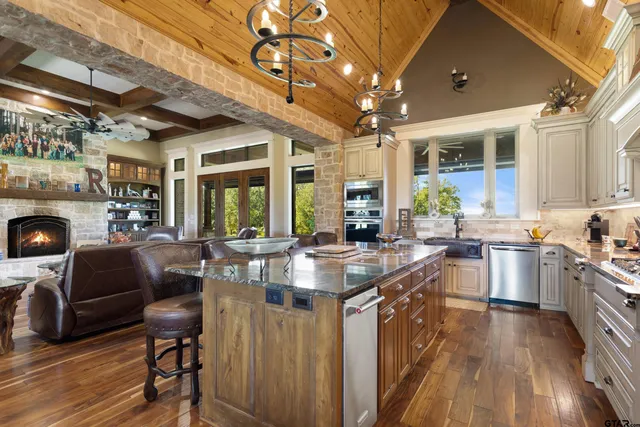 a large kitchen with a table and chairs
