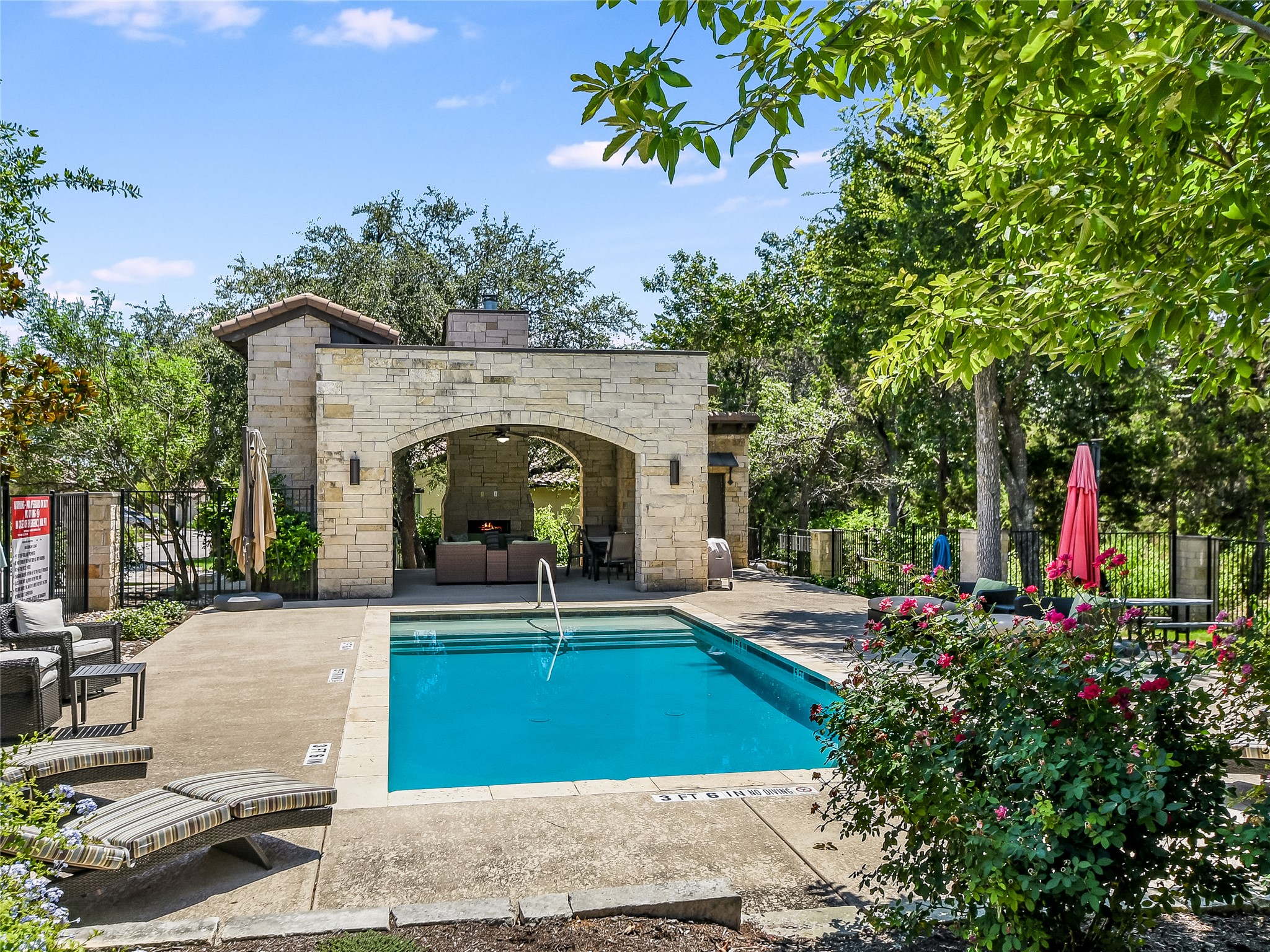 13510 Golden Wave Loop, Unit 53 Austin, TX 78738 - Photo 32 of 35 Community pool featuring a patio