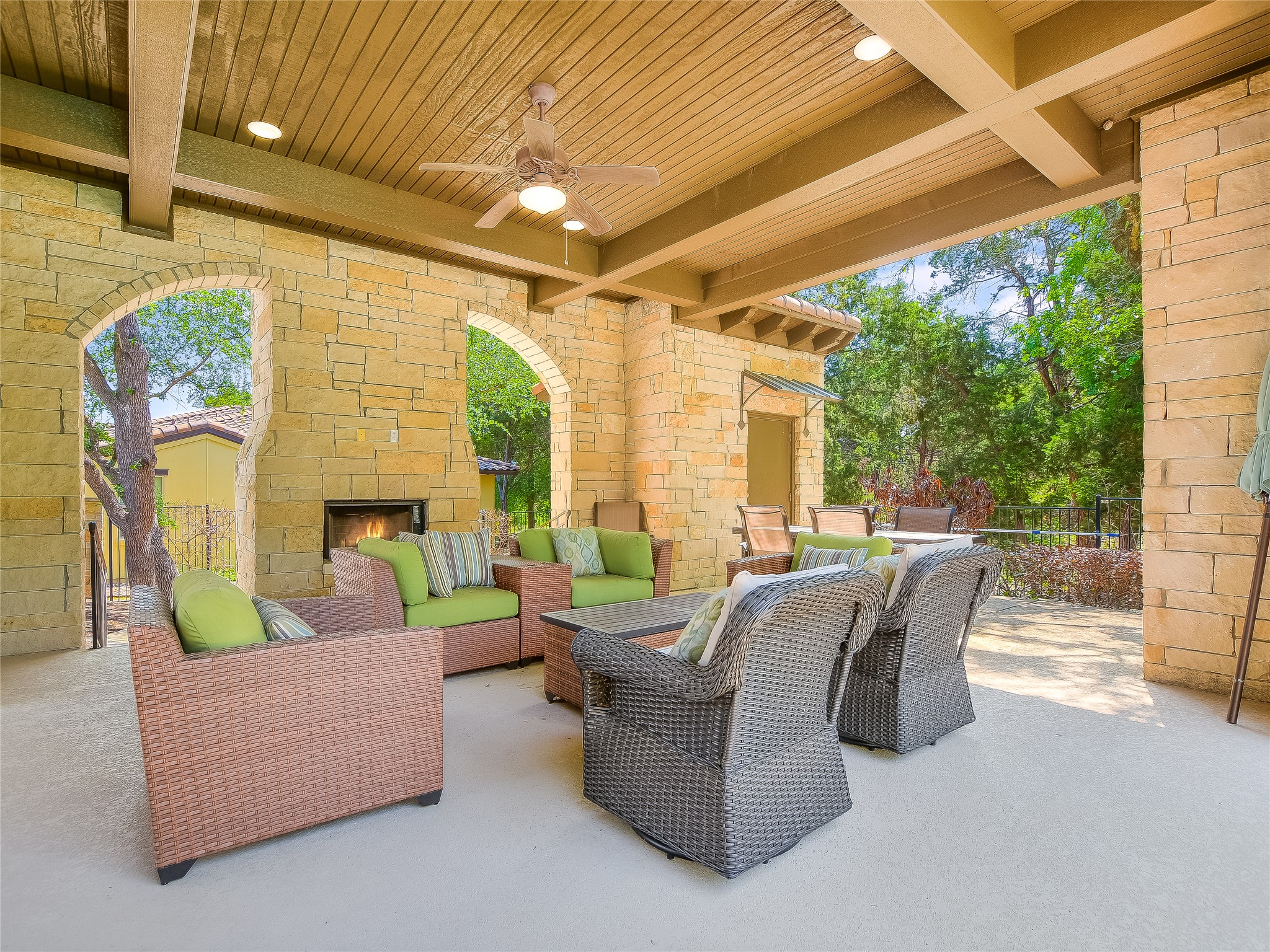13510 Golden Wave Loop, Unit 53 Austin, TX 78738 - Photo 35 of 35 View of patio with an outdoor living space with a fireplace and ceiling fan