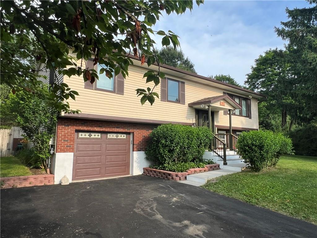 204 Valley View Drive Wallkill, NY 12589 - Photo 1 of 1 a front view of a house with a yard and garage