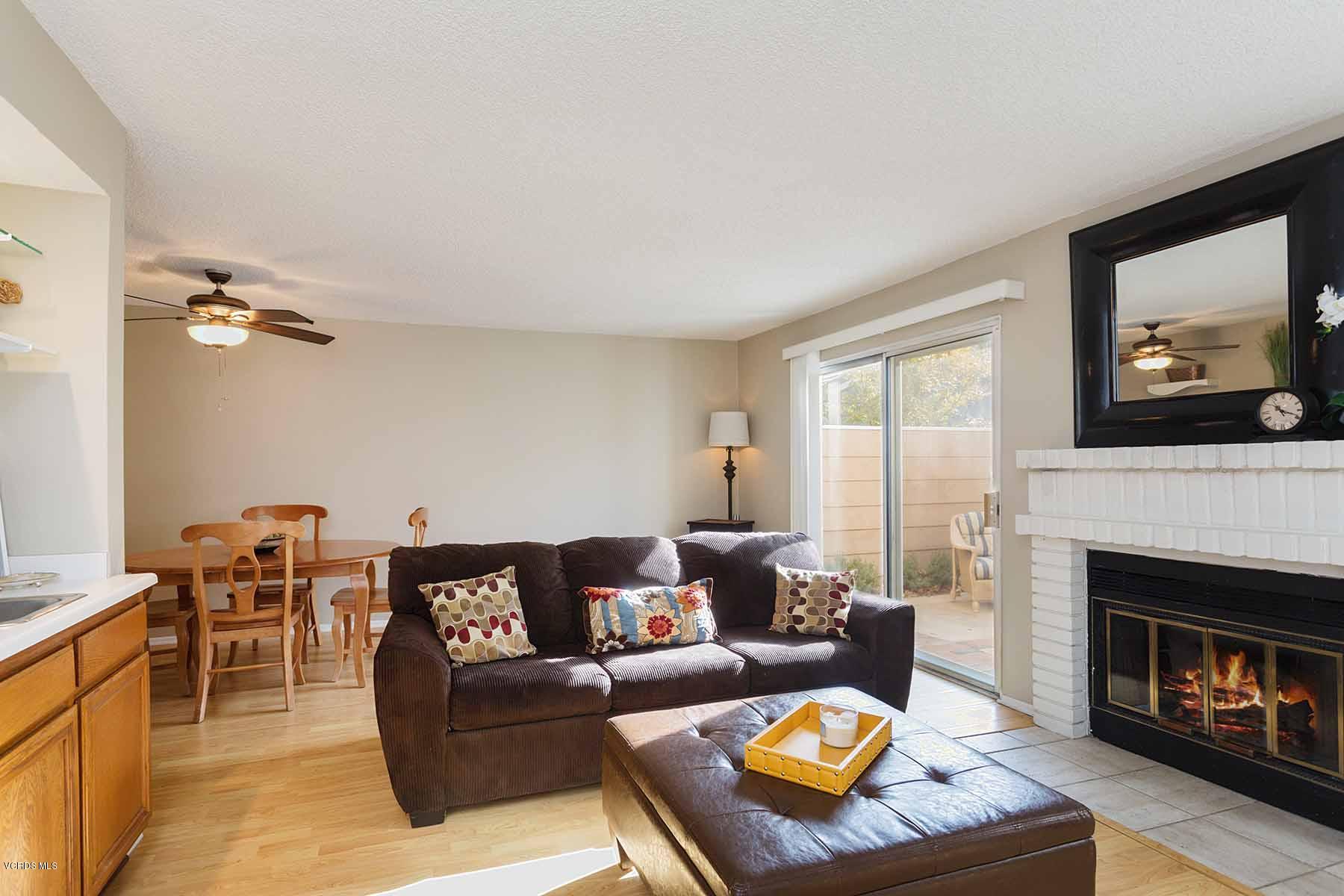 3902 Cochran Street, Unit 4 Simi Valley, CA 93063 - Photo 5 of 26 a living room with furniture and a fireplace