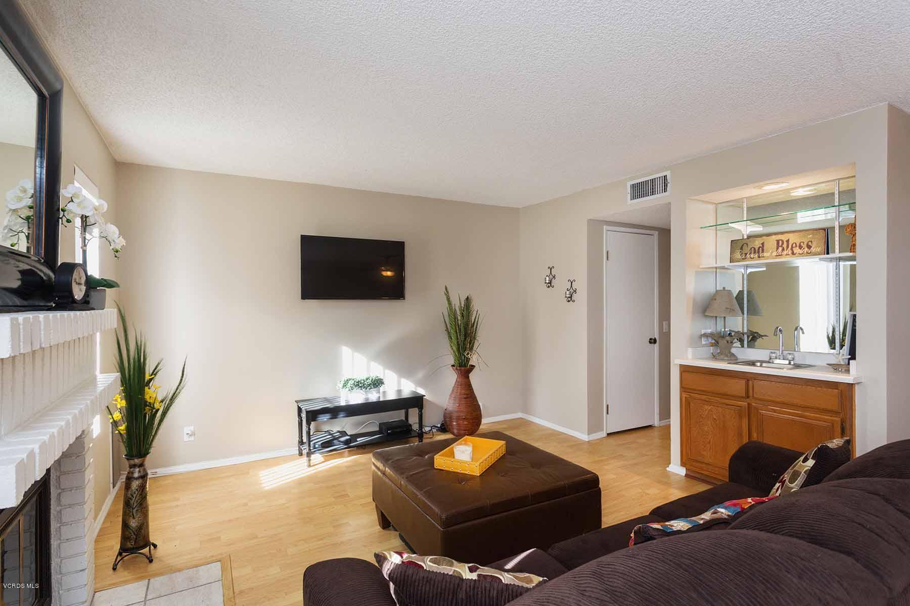 3902 Cochran Street, Unit 4 Simi Valley, CA 93063 - Photo 6 of 26 a living room with furniture and a flat screen tv