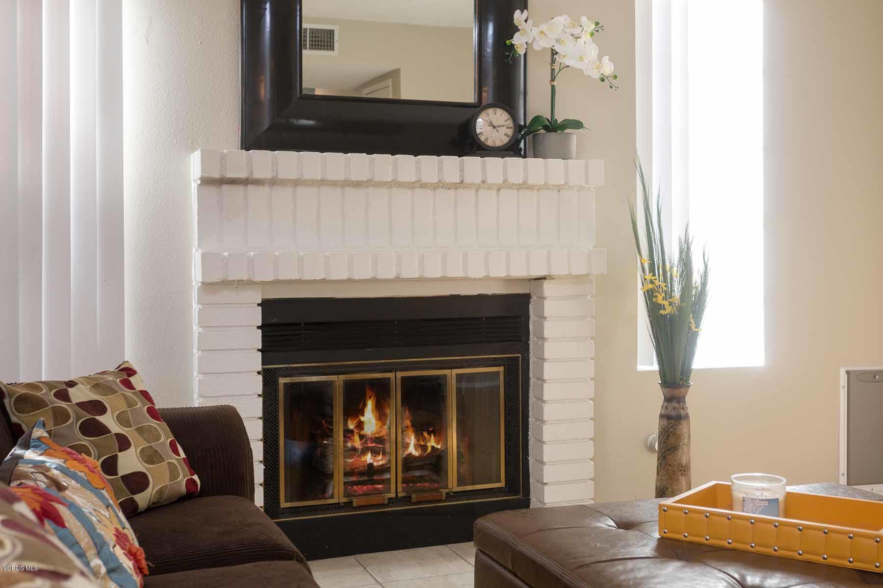 3902 Cochran Street, Unit 4 Simi Valley, CA 93063 - Photo 7 of 26 a living room with furniture and a fireplace