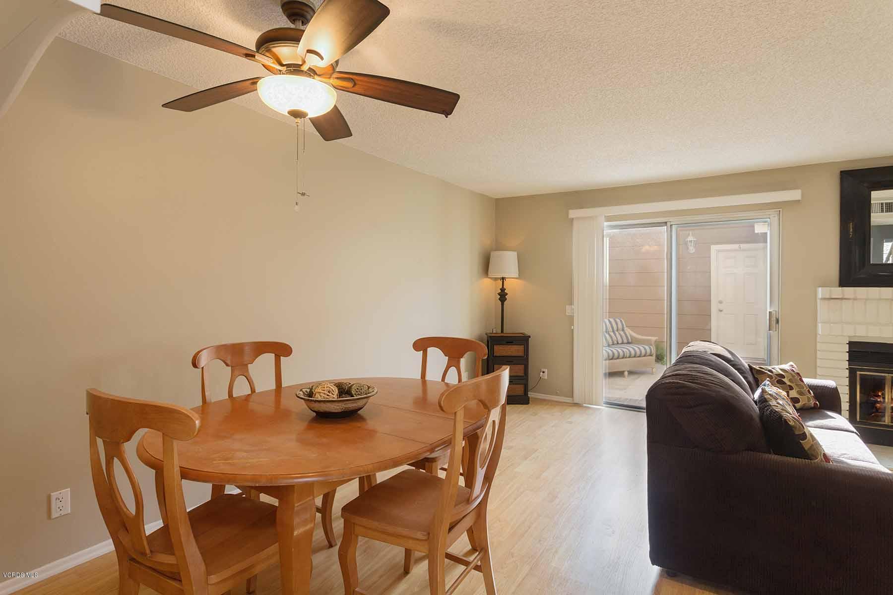 3902 Cochran Street, Unit 4 Simi Valley, CA 93063 - Photo 9 of 26 a dining room with furniture and chandelier