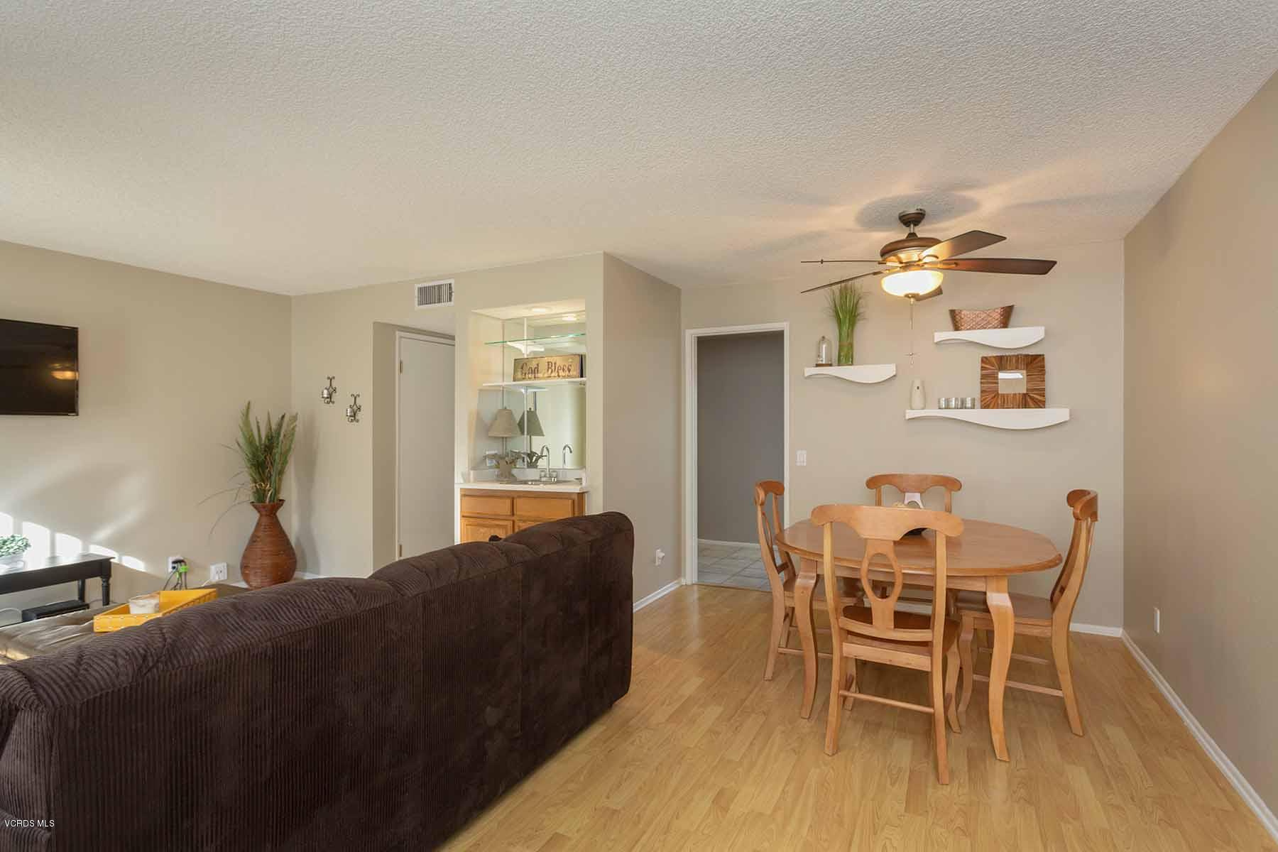 3902 Cochran Street, Unit 4 Simi Valley, CA 93063 - Photo 10 of 26 a living room with furniture and a flat screen tv