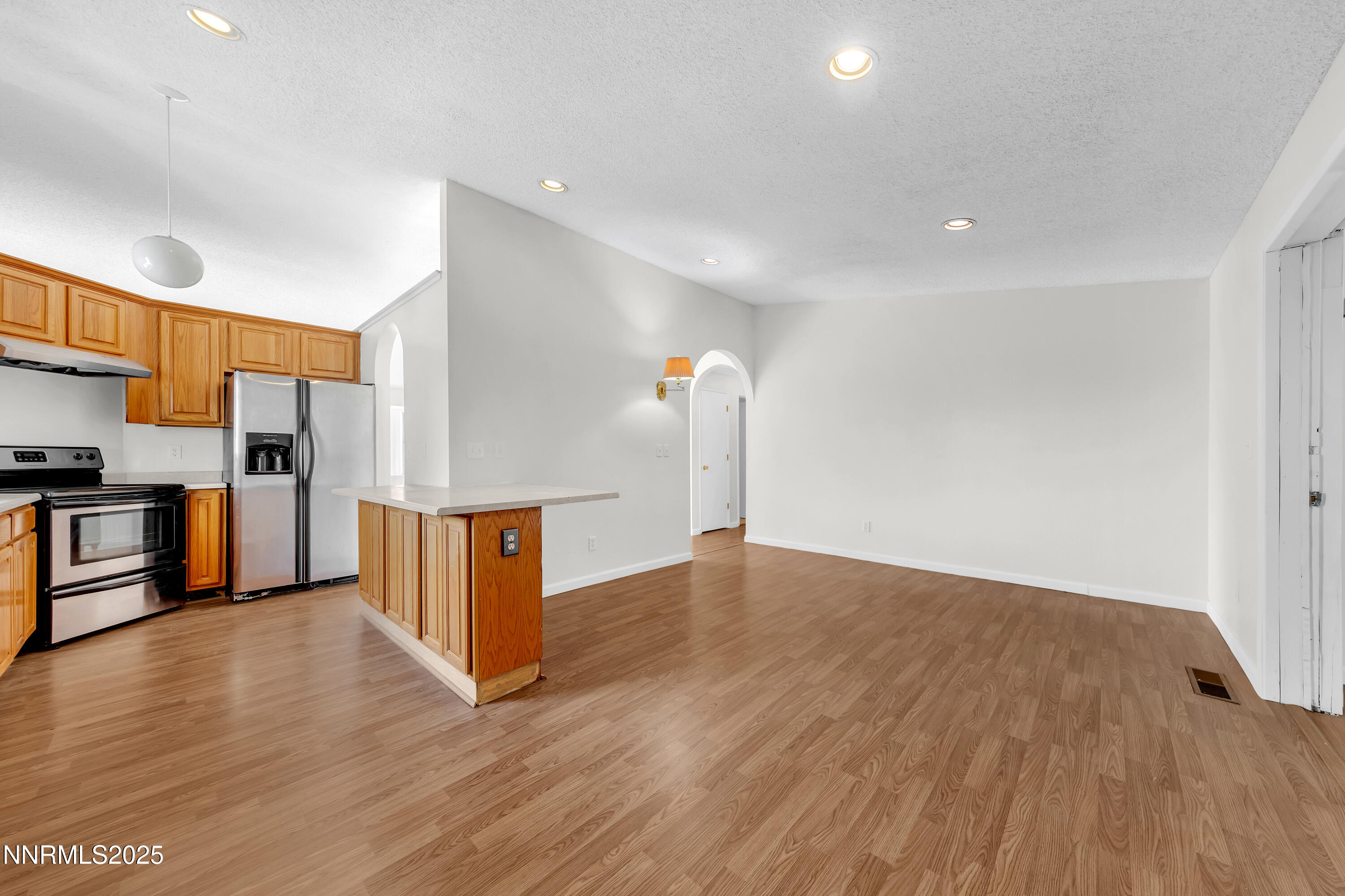 8581 Corrigan Way Reno, NV 89506 - Photo 13 of 40 a view of a kitchen with wooden floor
