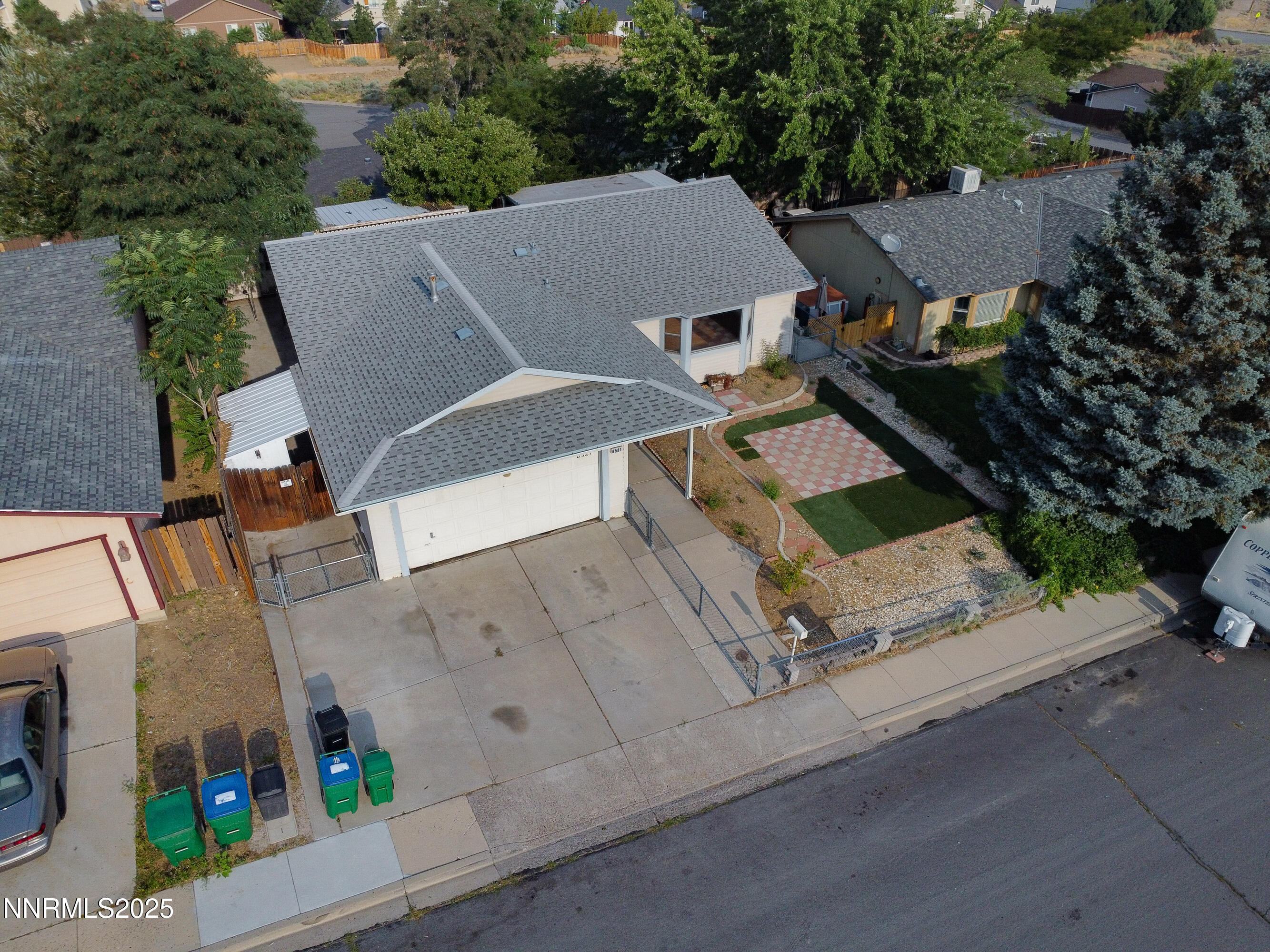 8581 Corrigan Way Reno, NV 89506 - Photo 2 of 40 an aerial view of a house with garden space and street view