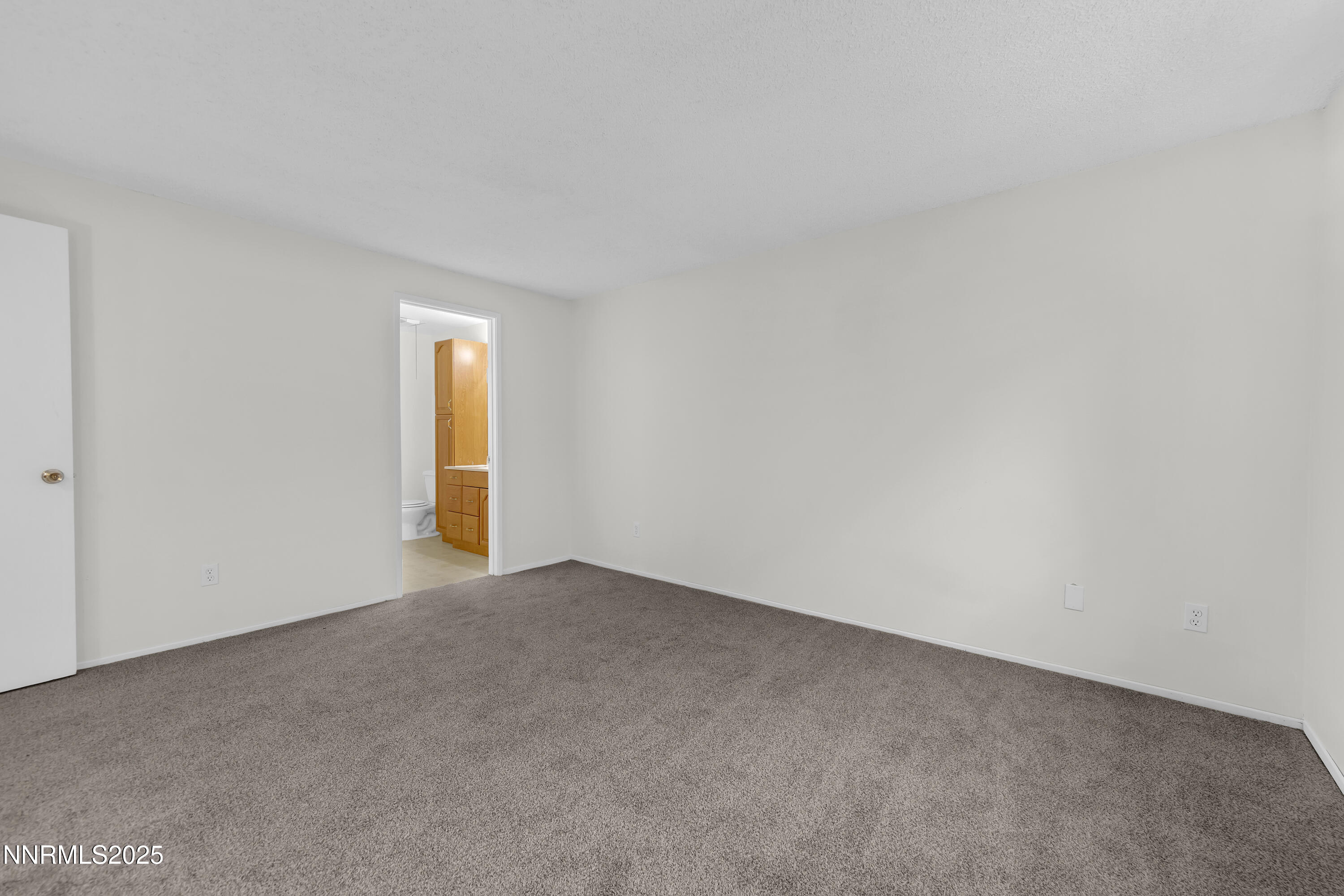8581 Corrigan Way Reno, NV 89506 - Photo 23 of 40 a view of an empty room with a window