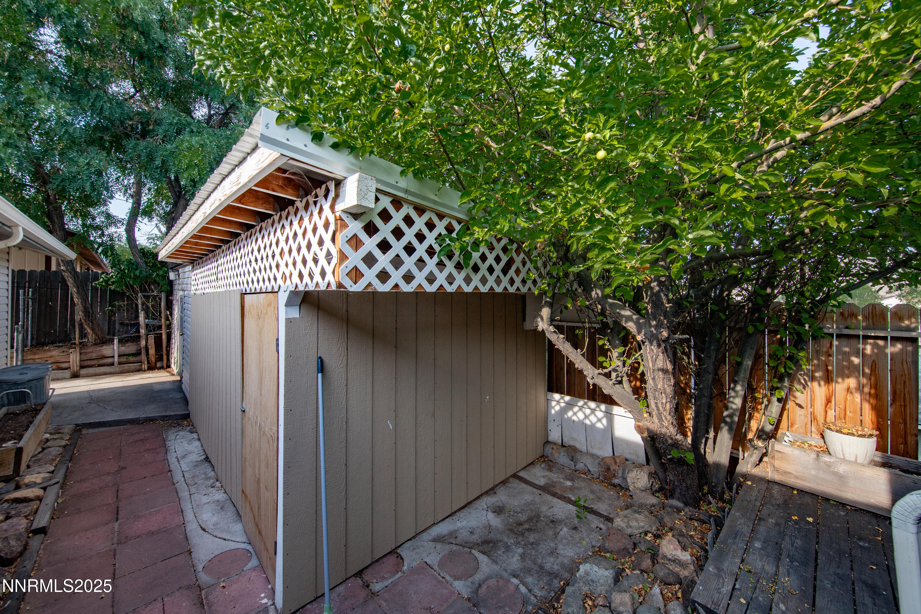 8581 Corrigan Way Reno, NV 89506 - Photo 35 of 40 a view of a house with a tree