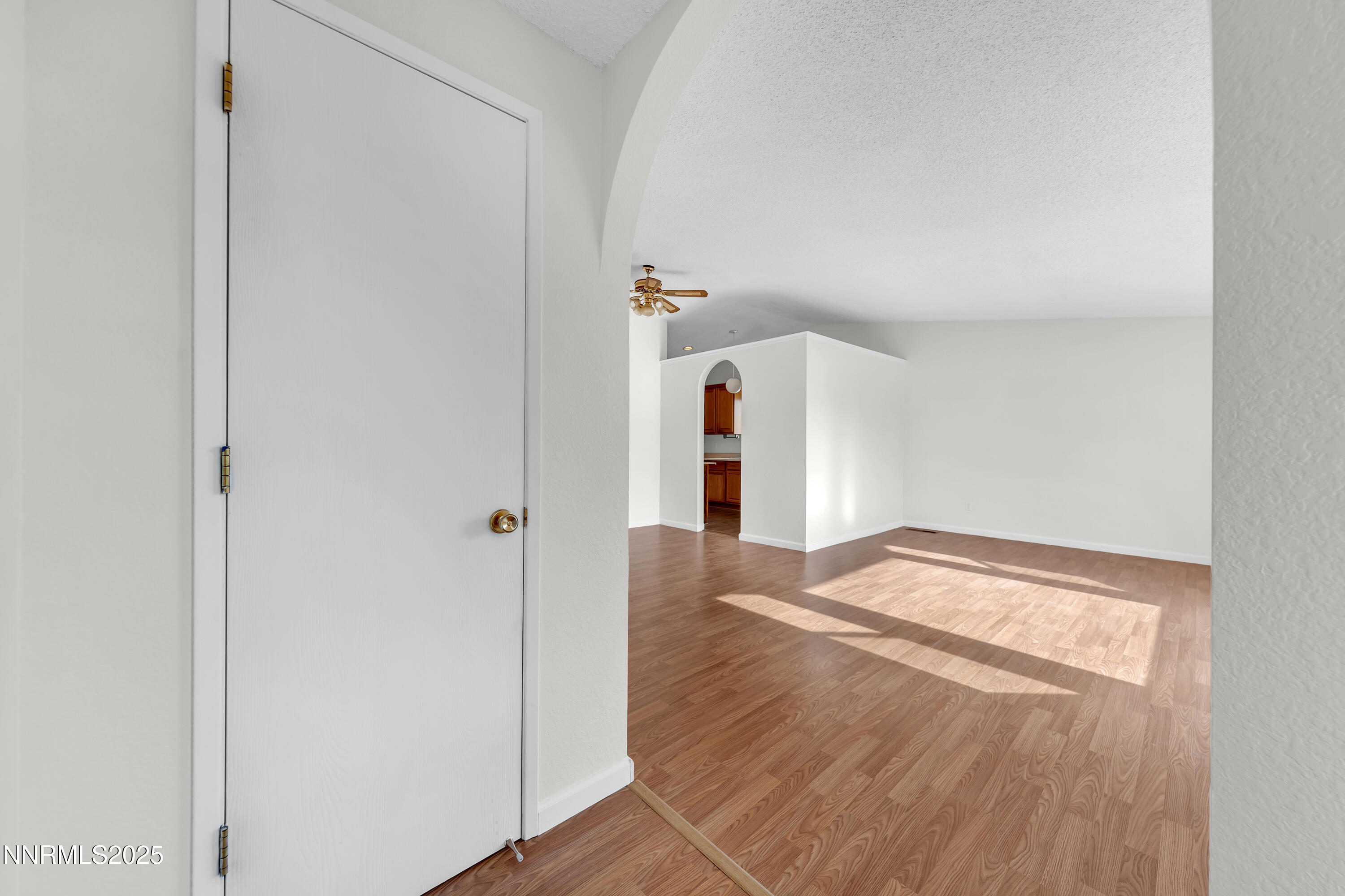 8581 Corrigan Way Reno, NV 89506 - Photo 4 of 40 a view of empty room with wooden floor