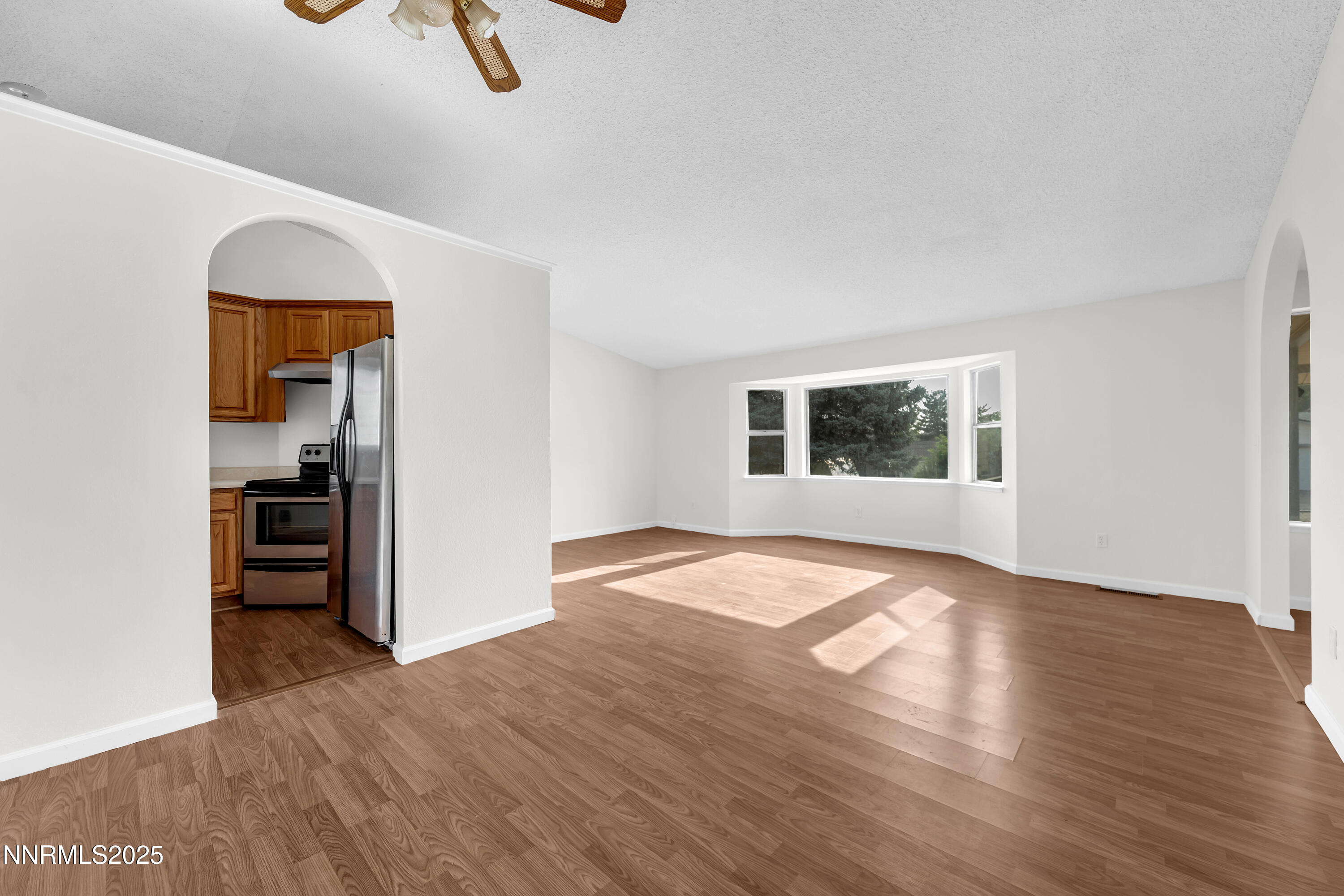 8581 Corrigan Way Reno, NV 89506 - Photo 8 of 40 a view of a room with wooden floor cabinet and a window