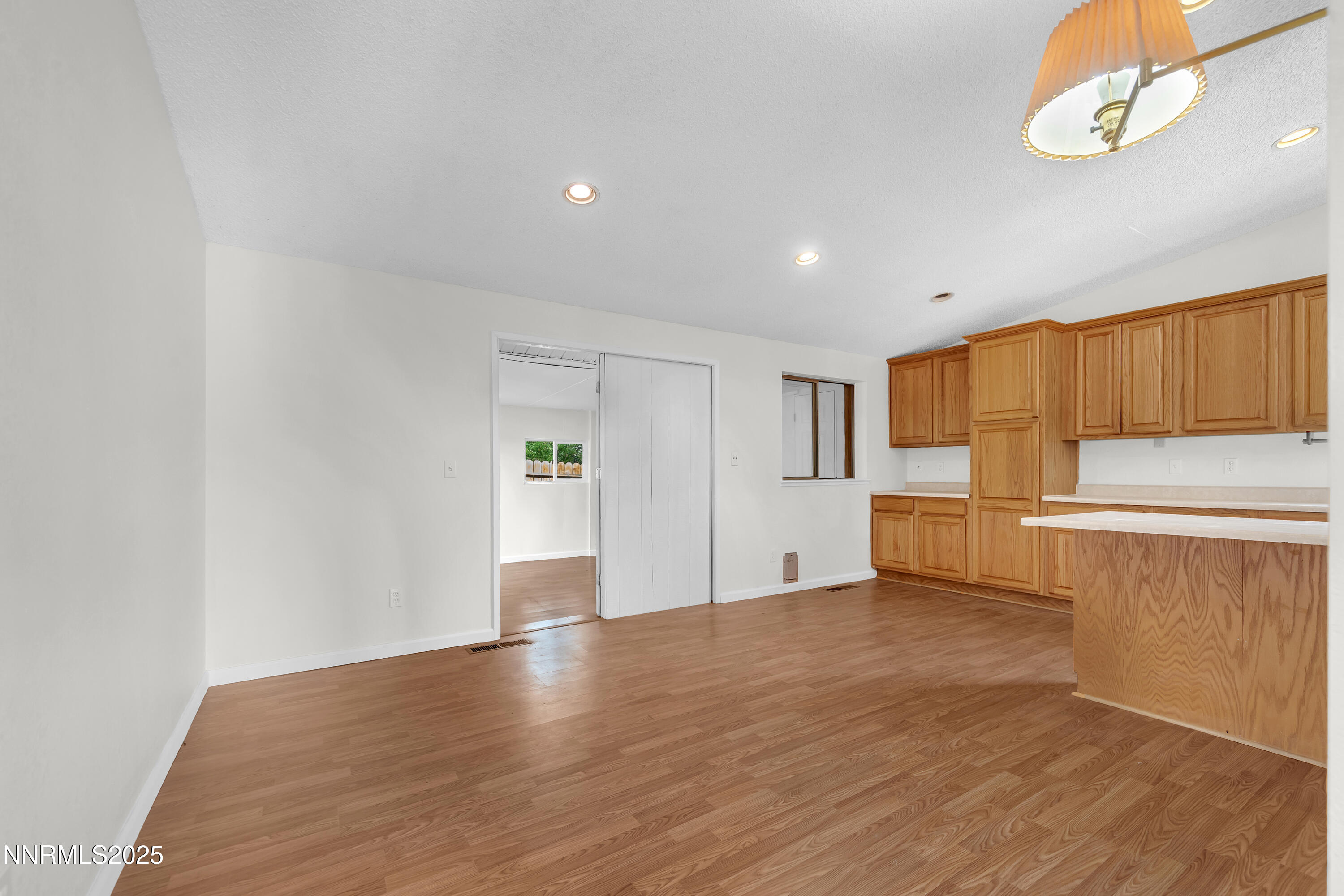 8581 Corrigan Way Reno, NV 89506 - Photo 10 of 40 a view of a kitchen with a sink and a refrigerator