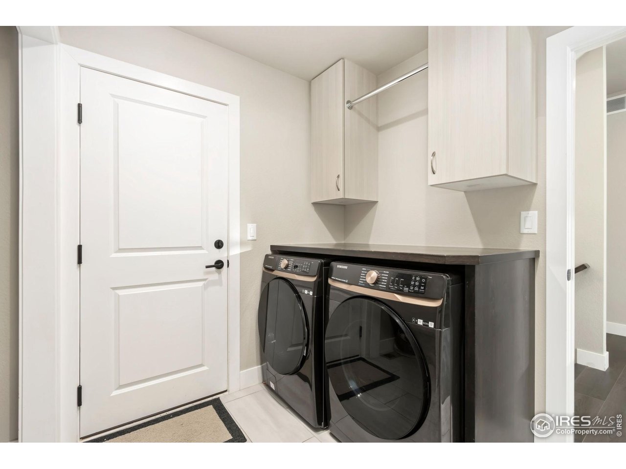 6709 Stone Point Drive Timnath, CO 80547 - Photo 20 of 41 a utility room with dryer and washer