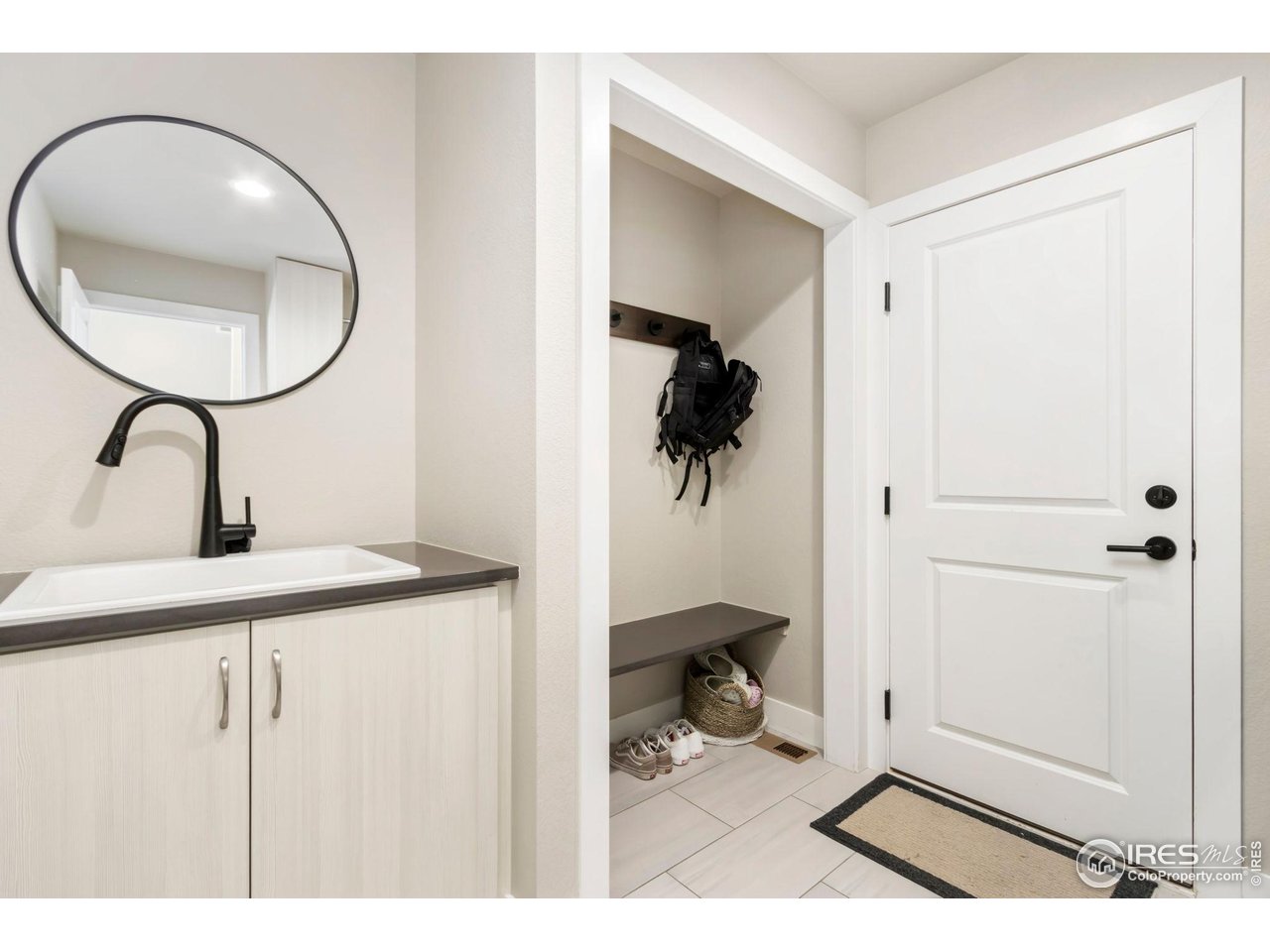 6709 Stone Point Drive Timnath, CO 80547 - Photo 21 of 41 a bathroom with a sink and a mirror