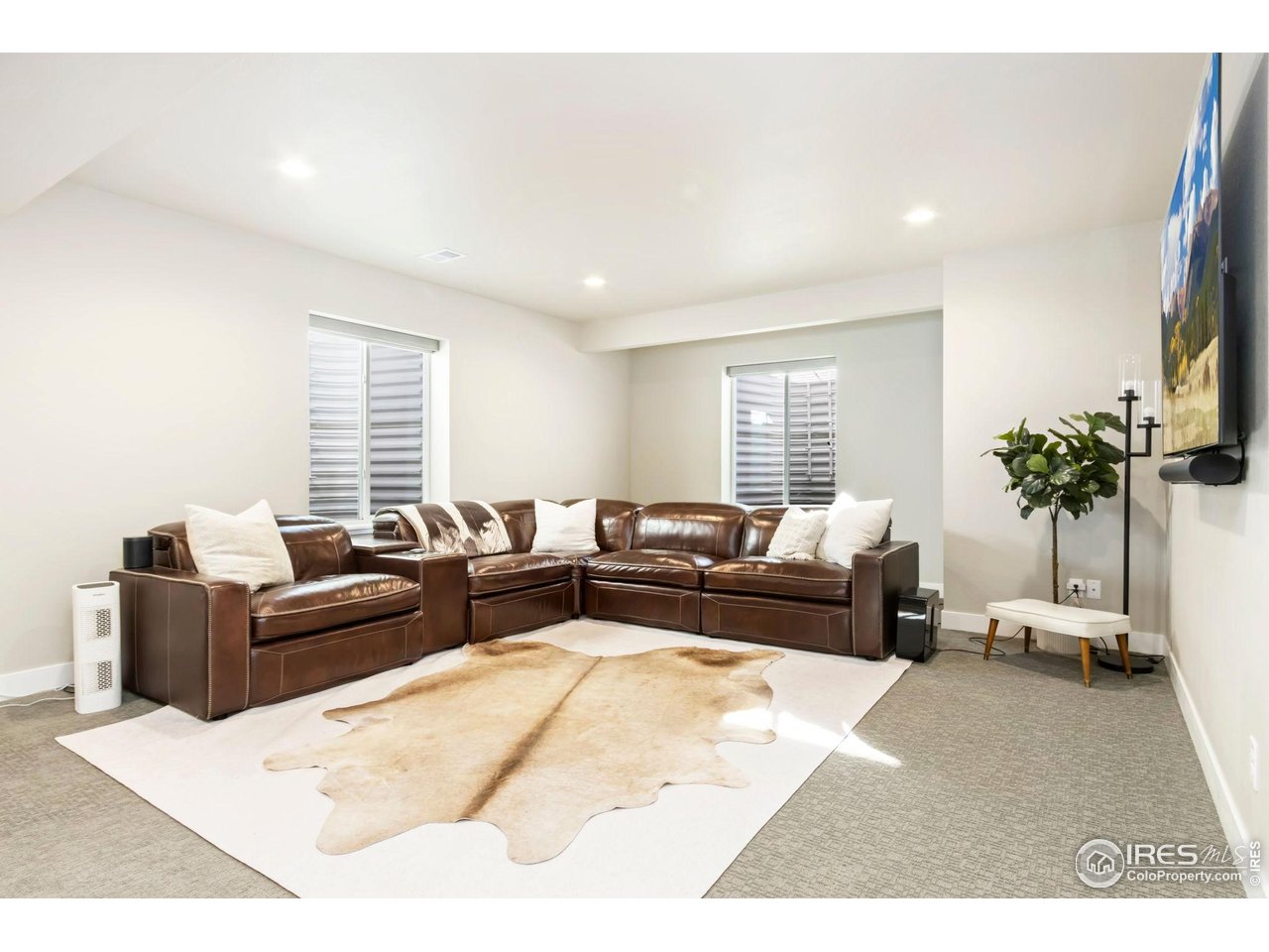 6709 Stone Point Drive Timnath, CO 80547 - Photo 31 of 41 a living room with furniture and a large window
