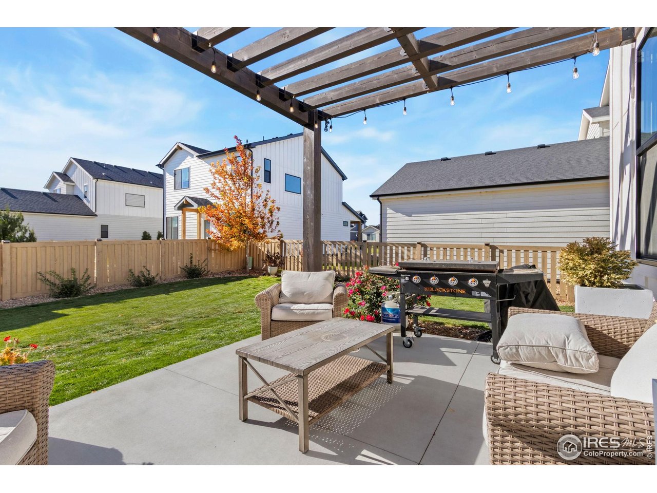6709 Stone Point Drive Timnath, CO 80547 - Photo 36 of 41 a outdoor living space with furniture and garden view