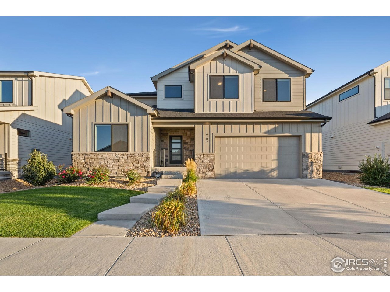 6709 Stone Point Drive Timnath, CO 80547 - Photo 40 of 41 a front view of a house with a yard