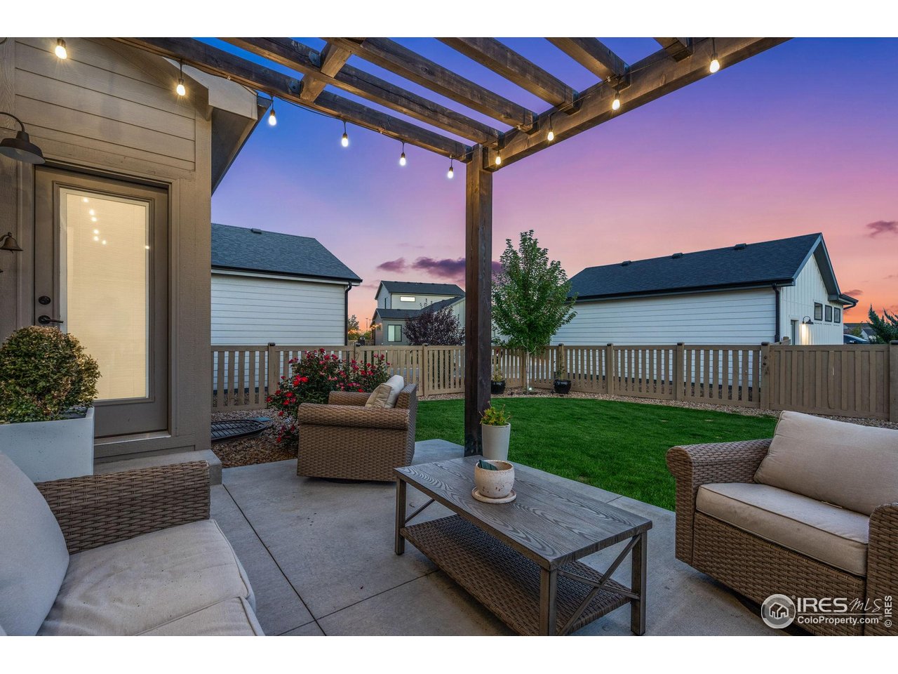 6709 Stone Point Drive Timnath, CO 80547 - Photo 7 of 41 a outdoor living space with furniture and a garden