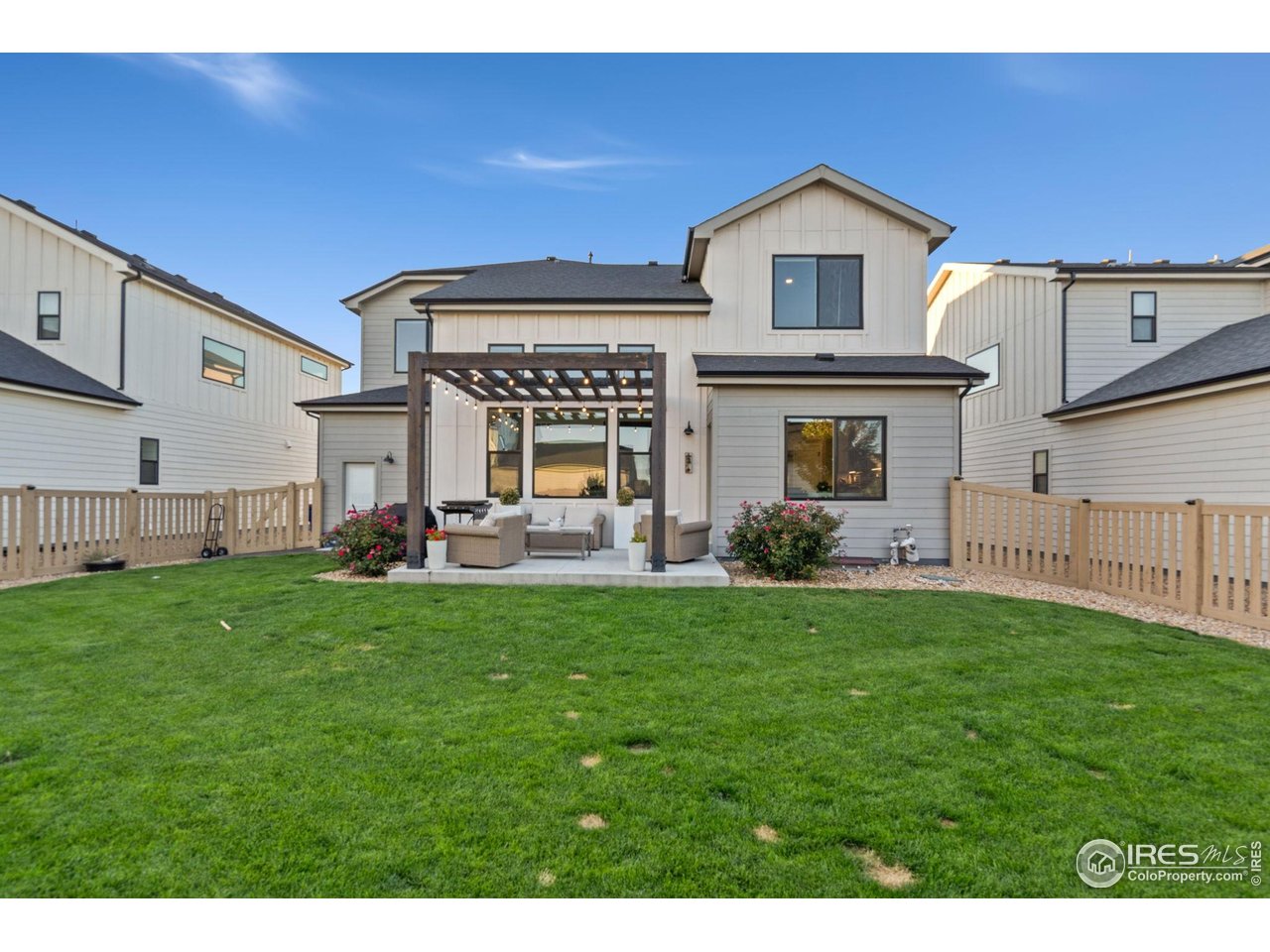 6709 Stone Point Drive Timnath, CO 80547 - Photo 8 of 41 a view of an house with backyard porch and garden