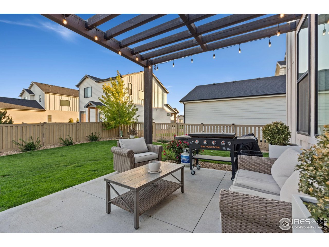 6709 Stone Point Drive Timnath, CO 80547 - Photo 9 of 41 a outdoor living space with furniture and a rug