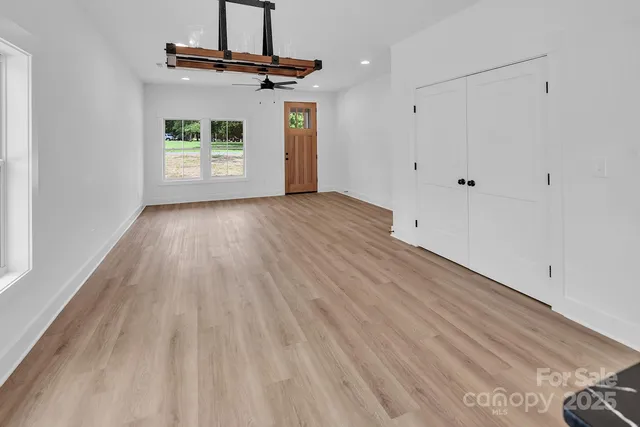 a view of a kitchen with wooden floor