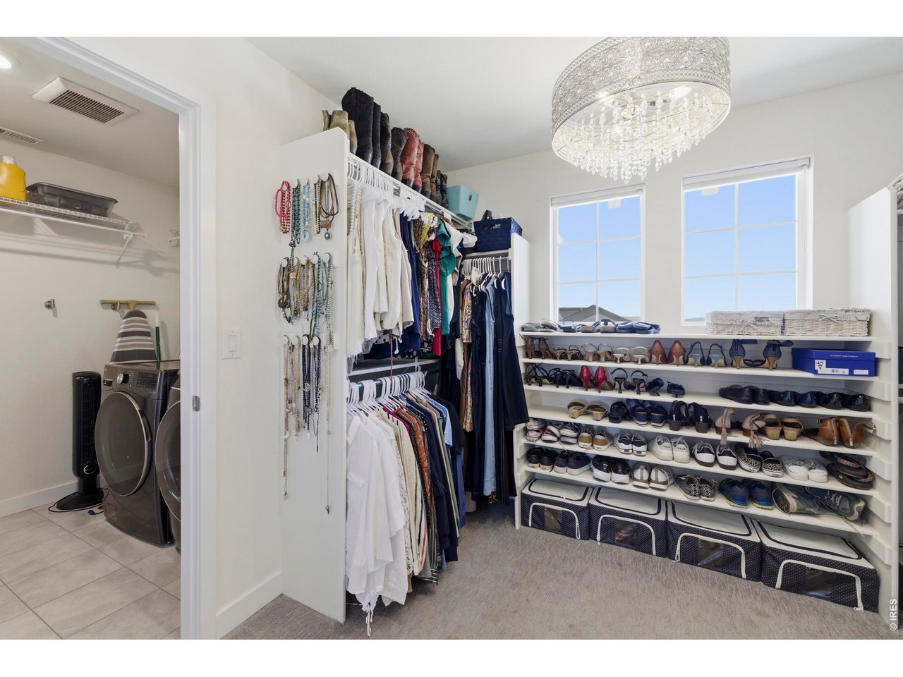 2910 Water View Street Timnath, CO 80547 - Photo 26 of 50 a view of walk in closet with clothes and shoes