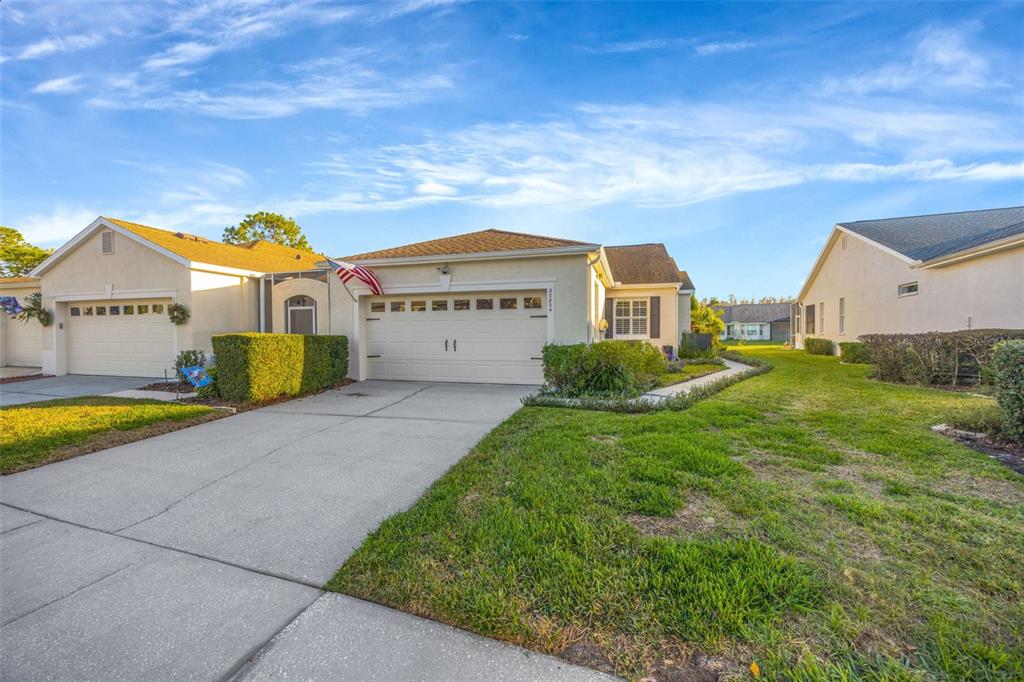 20804 Eustis Road Land O Lakes, FL 34637 - Photo 1 of 65 a view of an house with backyard and swimming pool