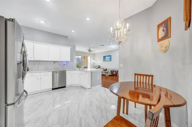 an aerial view of a house with a garden and lake view