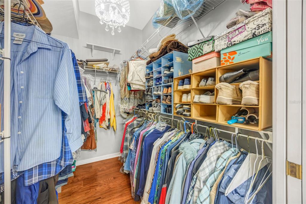 20804 Eustis Road Land O Lakes, FL 34637 - Photo 22 of 65 a view of walk in closet with clothes and shoes