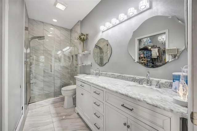 an aerial view of a house with a swimming pool yard and outdoor seating