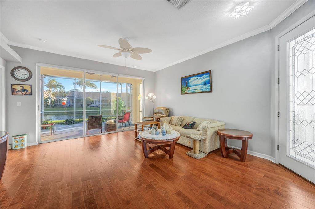 20804 Eustis Road Land O Lakes, FL 34637 - Photo 5 of 65 a living room with furniture and a large window