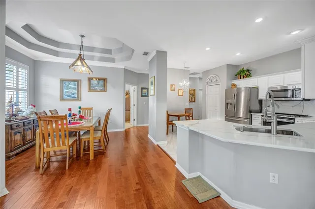 a bed room with a bed and a chandelier