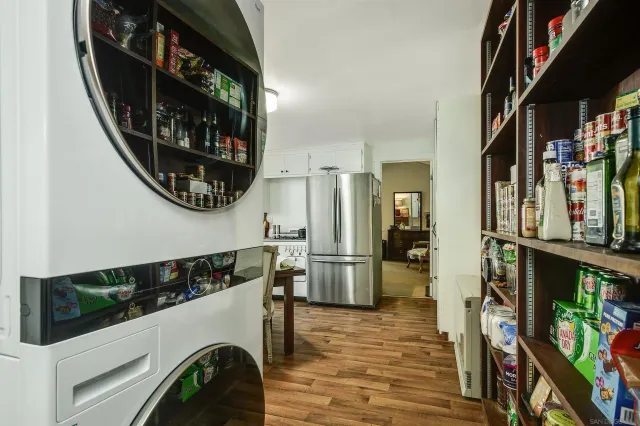 a view of a hallway with washer and dryer