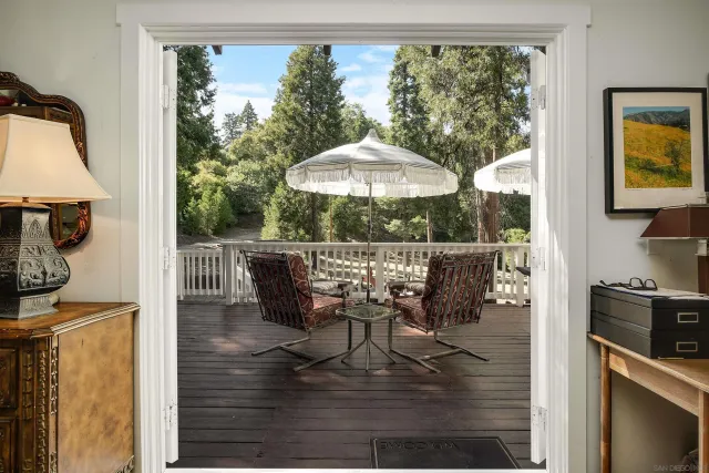 a table and chairs in a balcony