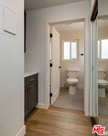 a view of a bathroom with toilet shower and a sink