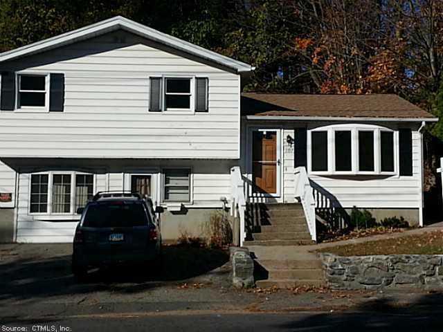 a front view of a house with garage