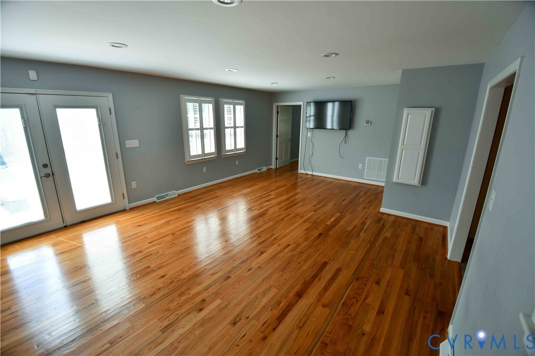 288 Daniel Road Blackstone, VA 23824 - Photo 16 of 38 Unfurnished living room featuring french doors, wo