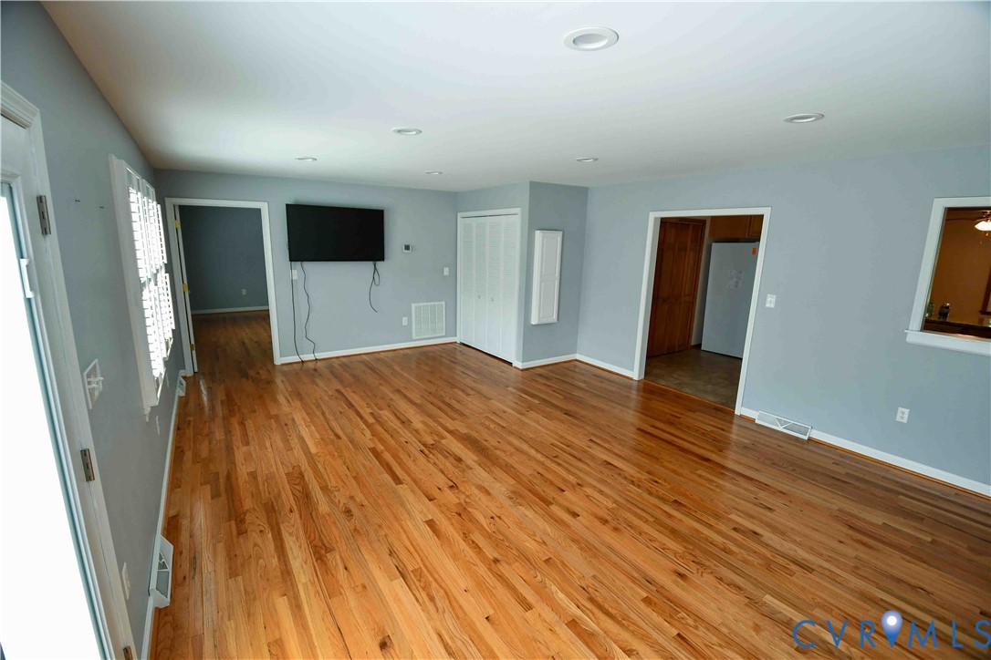 288 Daniel Road Blackstone, VA 23824 - Photo 18 of 38 Unfurnished living room featuring light wood finis