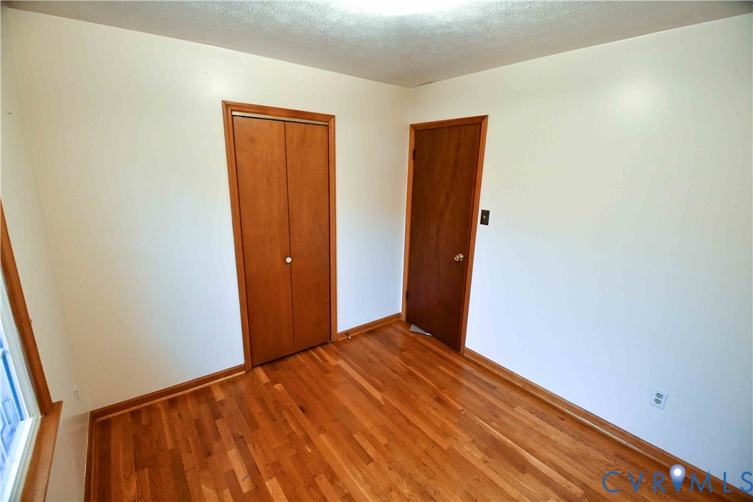 288 Daniel Road Blackstone, VA 23824 - Photo 28 of 38 Unfurnished bedroom with wood finished floors, a c