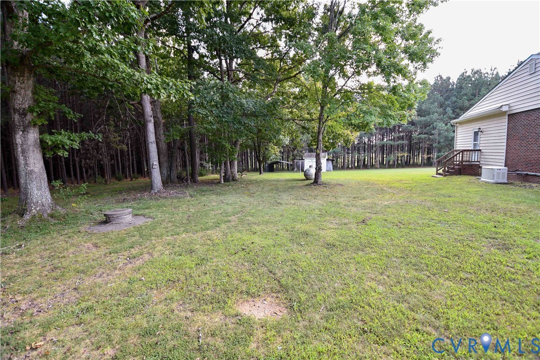 288 Daniel Road Blackstone, VA 23824 - Photo 38 of 38 View of green lawn with view of wooded area