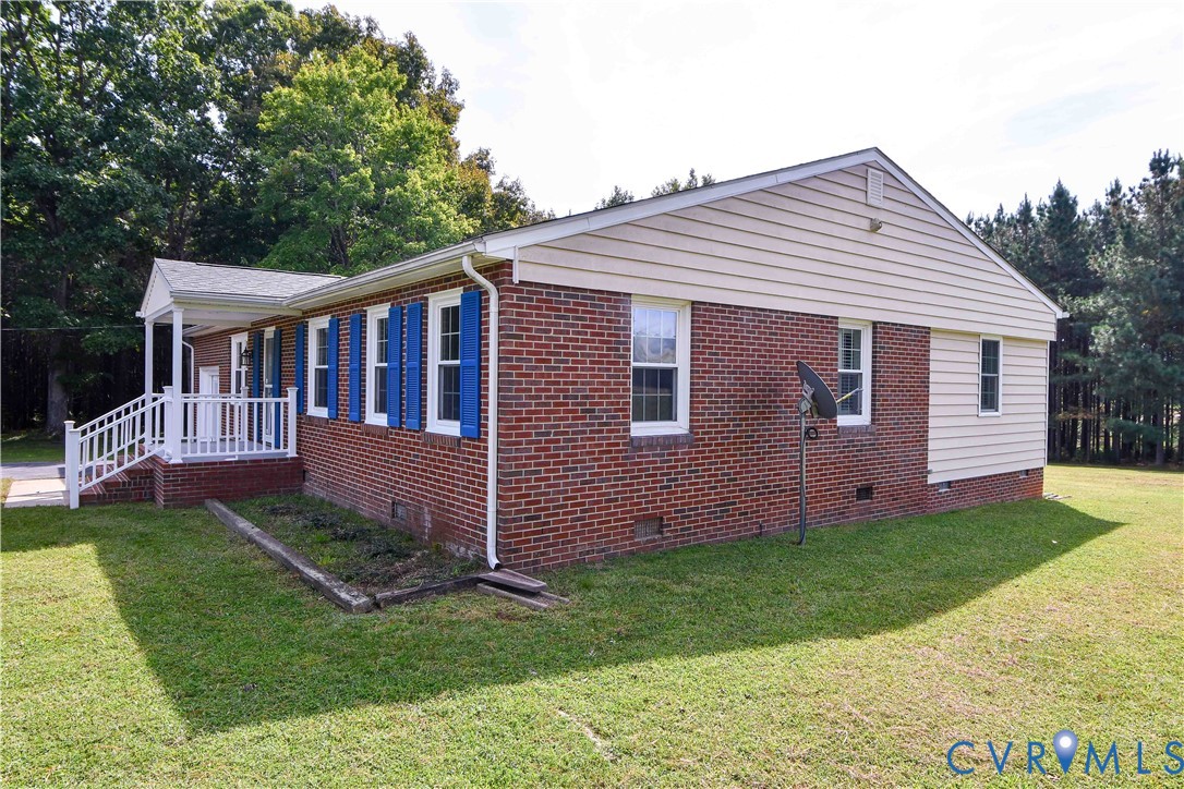 288 Daniel Road Blackstone, VA 23824 - Photo 5 of 38 View of property exterior with crawl space, a yard