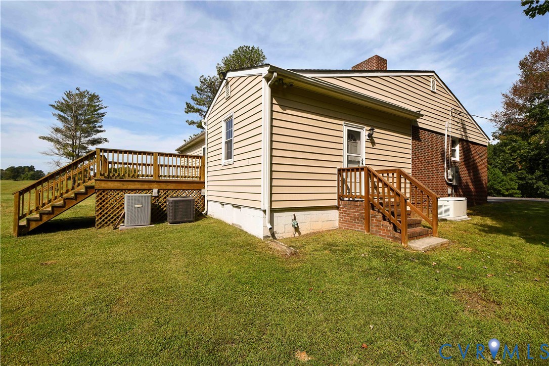 288 Daniel Road Blackstone, VA 23824 - Photo 6 of 38 View of side of property featuring stairs, a lawn,