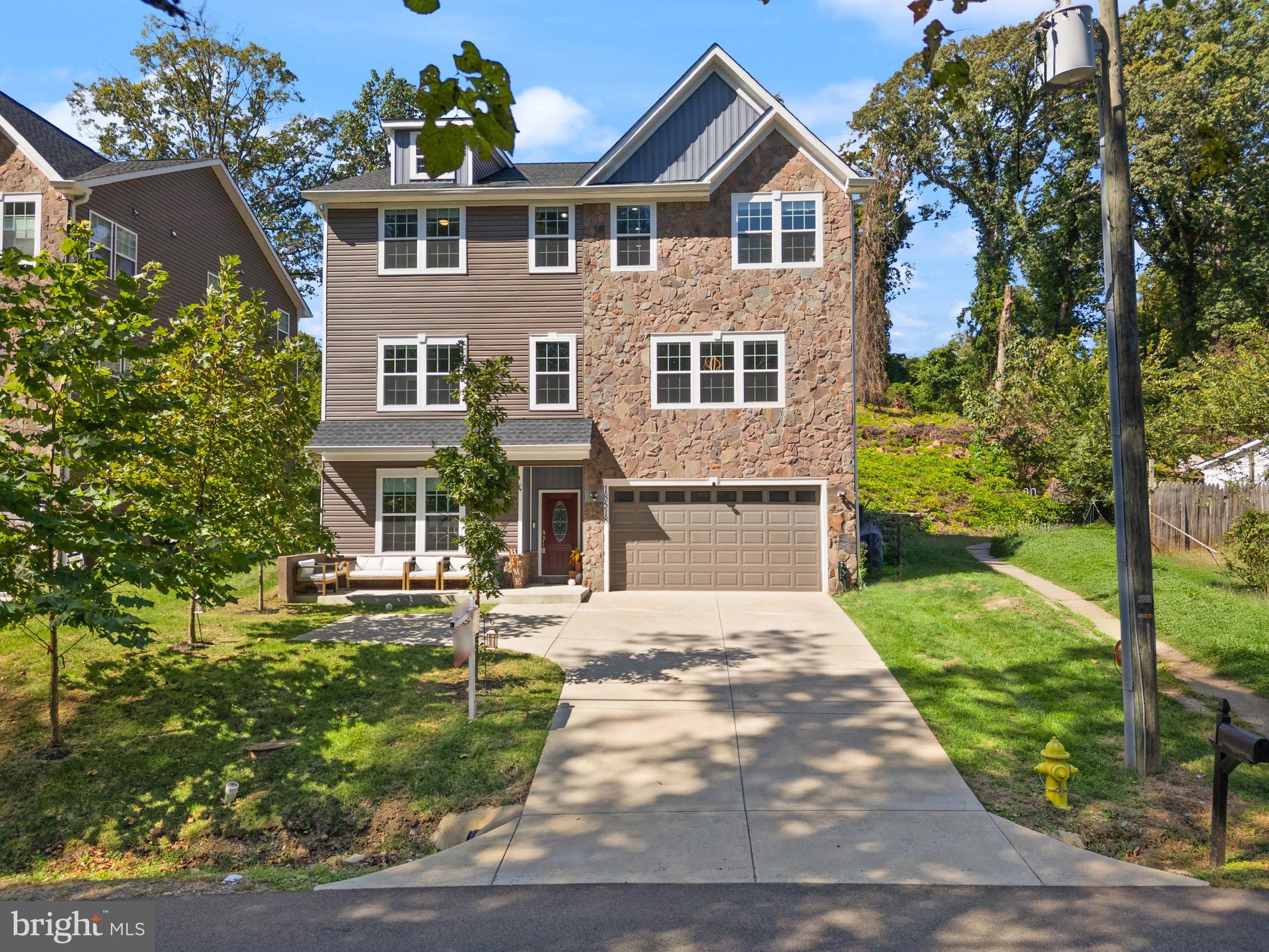18518 Old Triangle Road Triangle, VA 22172 - Photo 1 of 39 a front view of a house with a yard