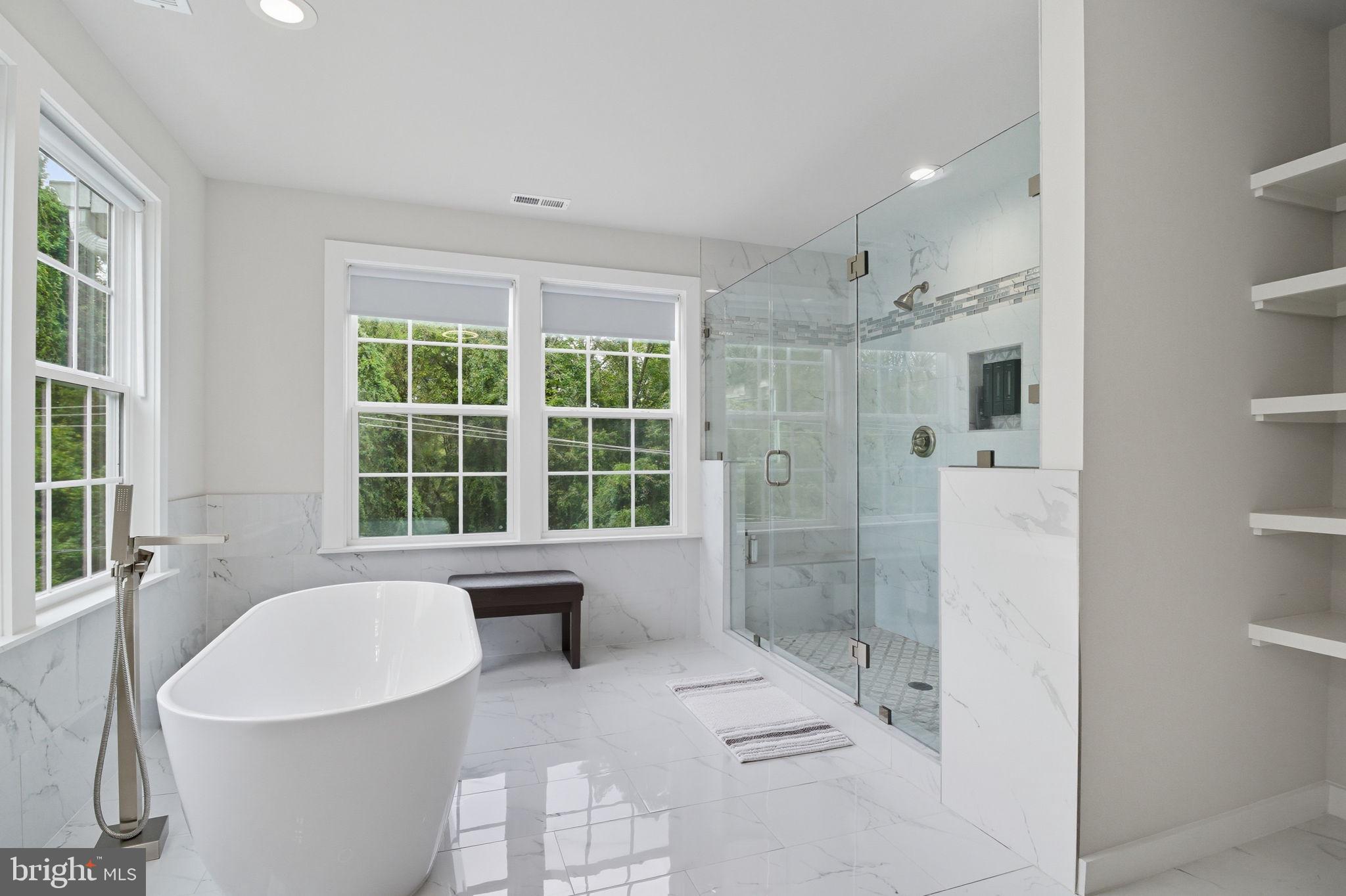 18518 Old Triangle Road Triangle, VA 22172 - Photo 23 of 39 a large bathroom with a tub sink shower and a mirror