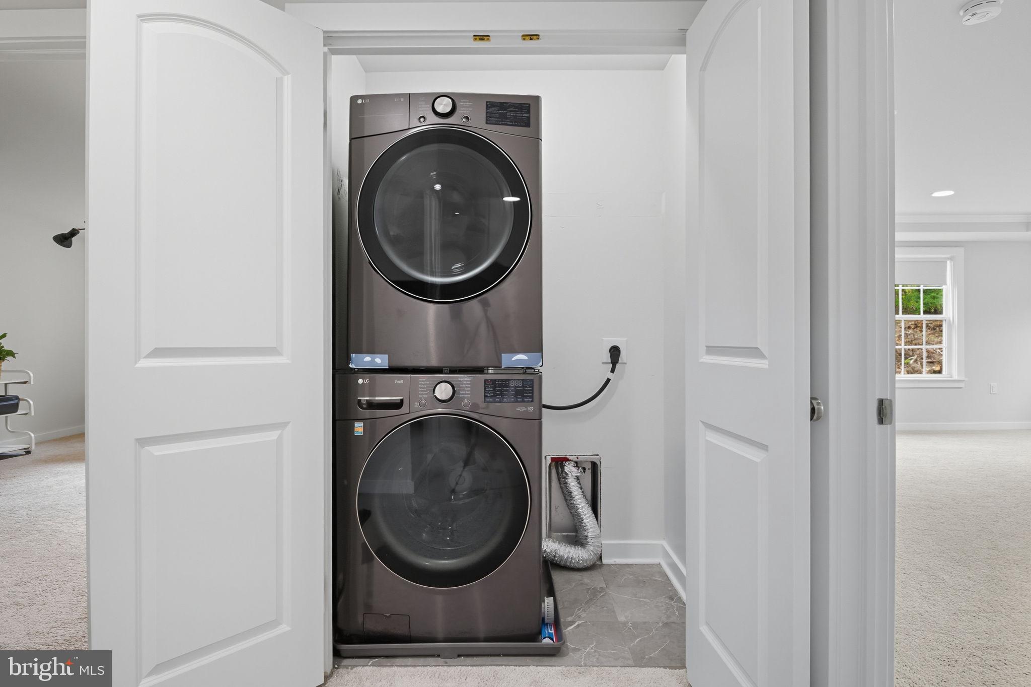 18518 Old Triangle Road Triangle, VA 22172 - Photo 27 of 39 a close view of a utility room with dryer and washer