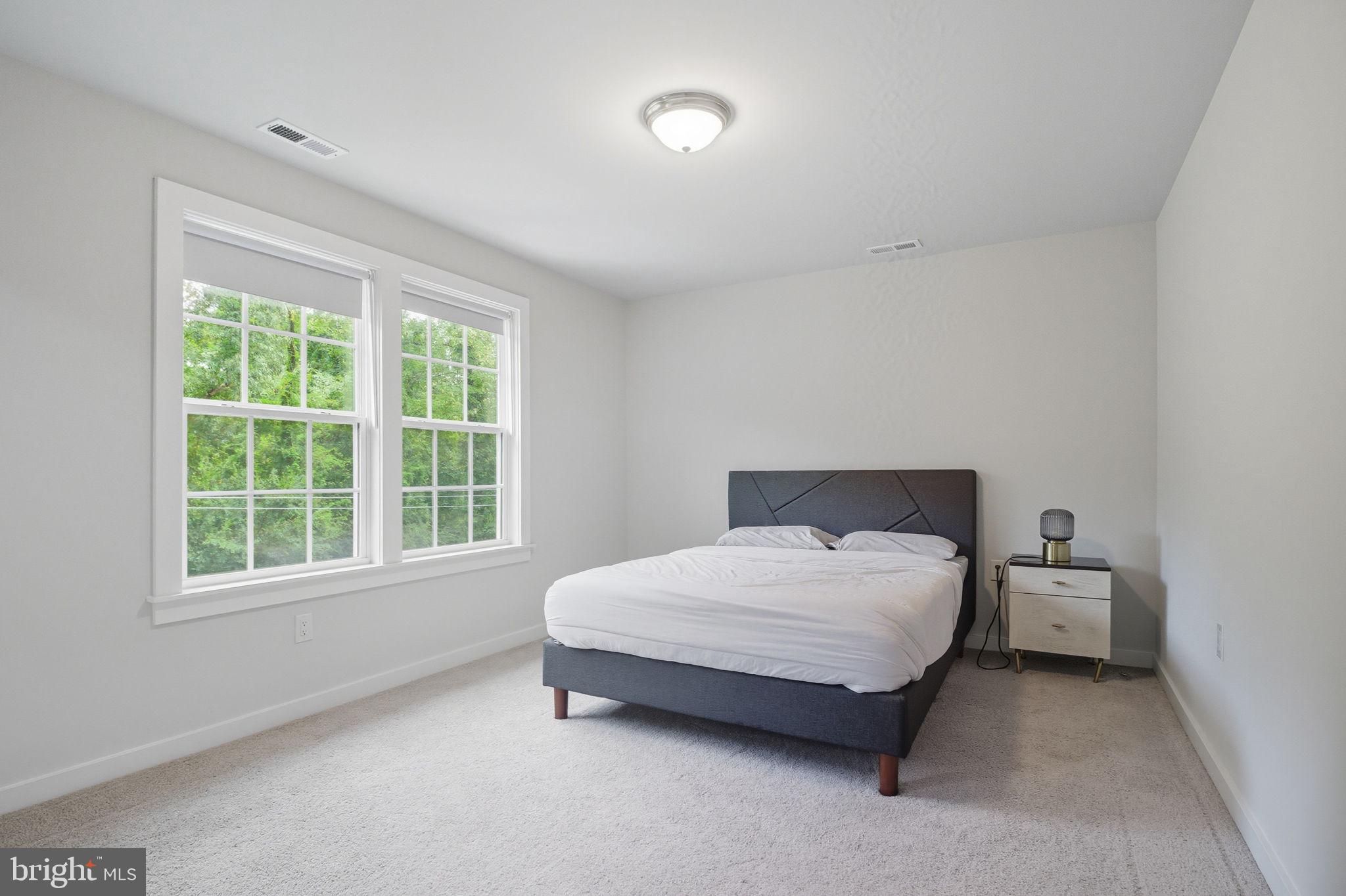 18518 Old Triangle Road Triangle, VA 22172 - Photo 28 of 39 a bedroom with a bed and window