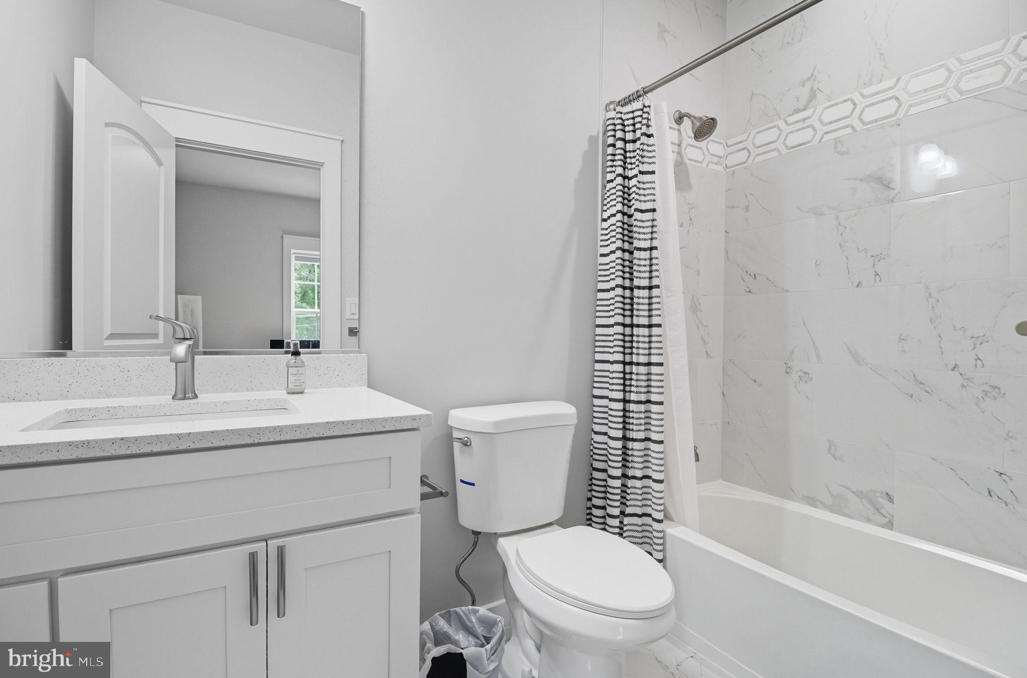 18518 Old Triangle Road Triangle, VA 22172 - Photo 29 of 39 a bathroom with a sink a toilet and a mirror